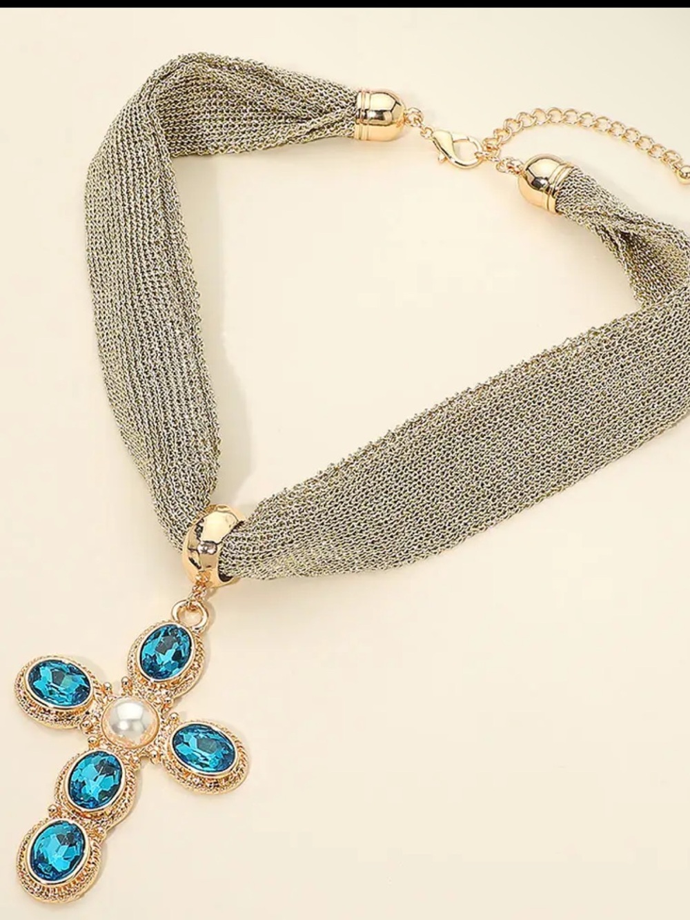Gold Cross Necklace with Blue Gemstones and Gray Mesh Chain